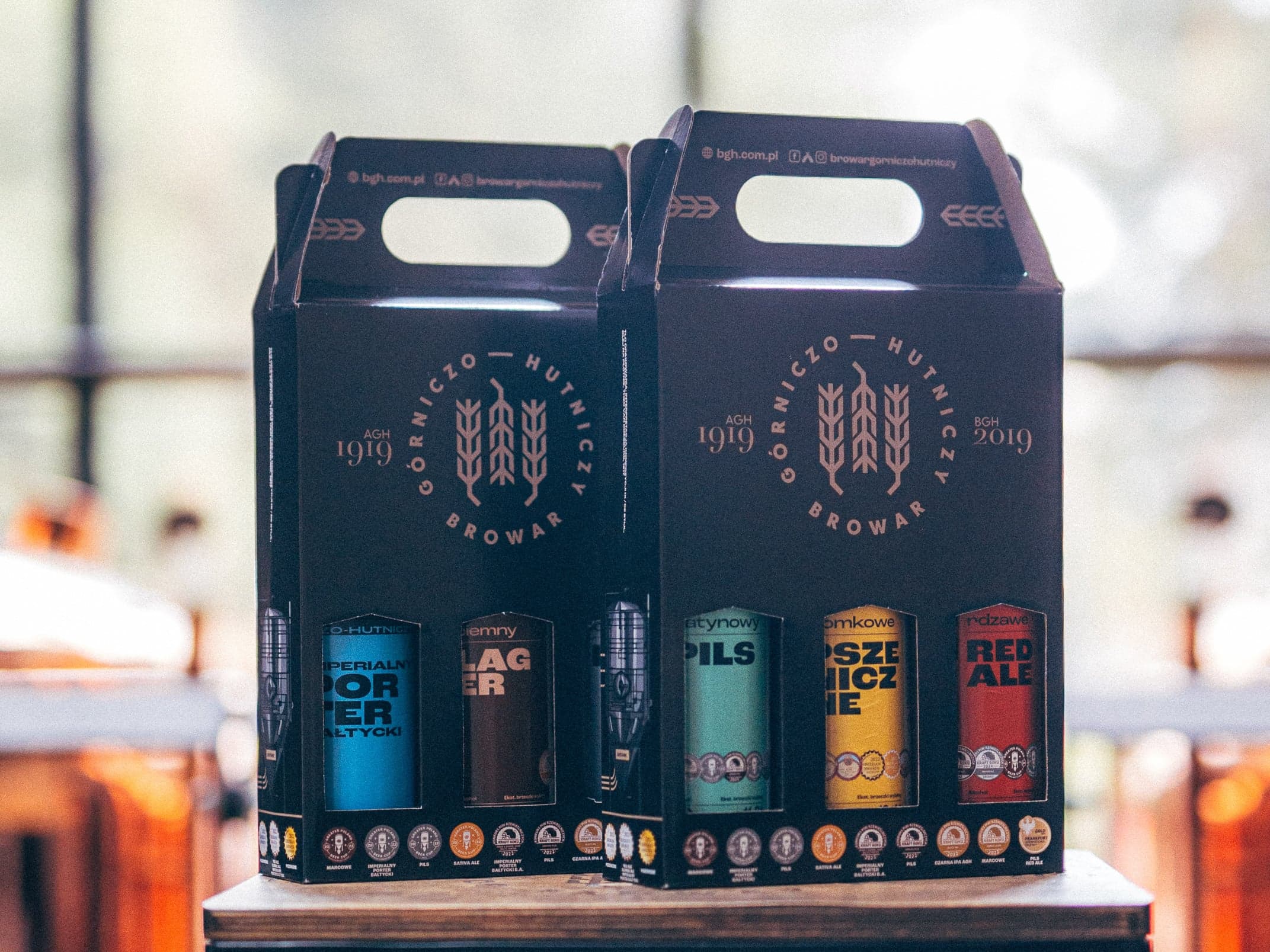 Two BGH three-packs in black gift boxes