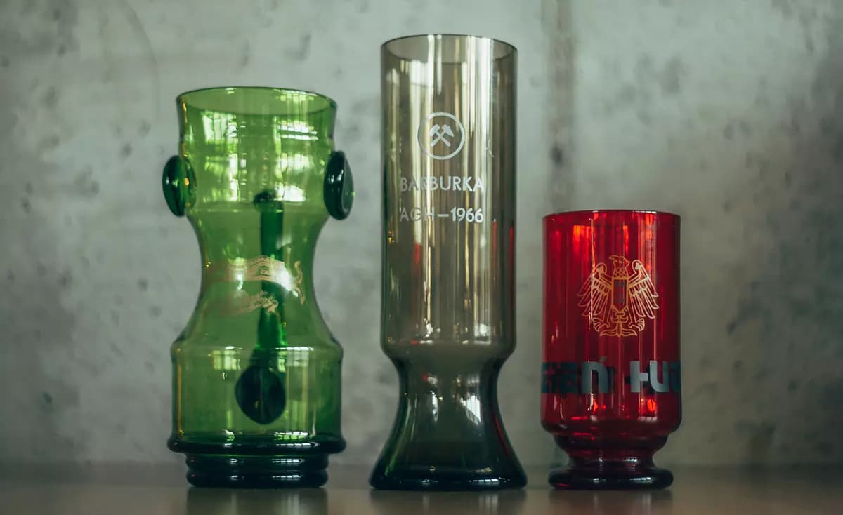 Three historic glasses, one of them engraved “Barburka AGH 1966”