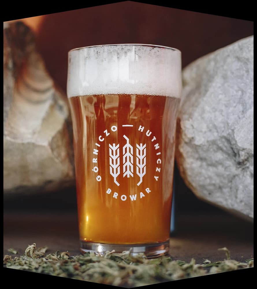 Beer poured from the tap into a glass bearing the BGH logo